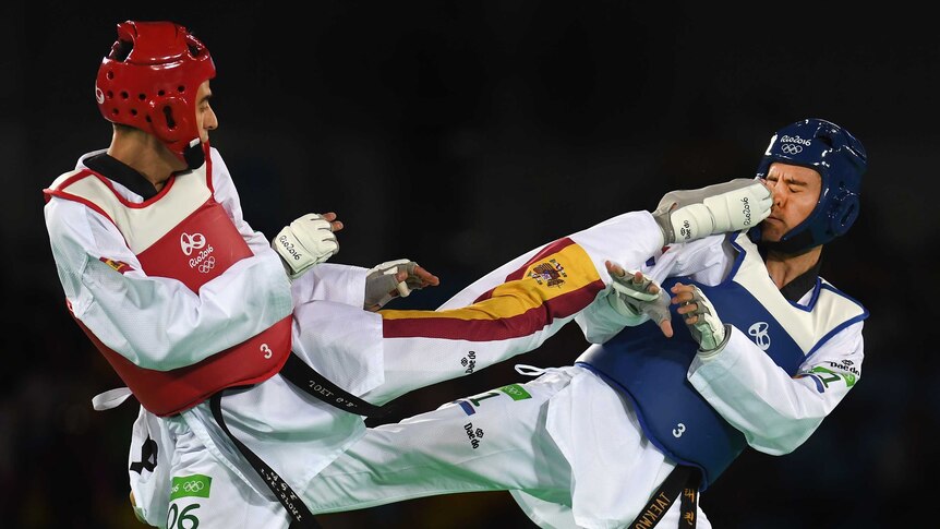 Joel Gonzalez Bonilla of Spain (Red) competes against Filip Grgic of Croatia during the Mens 68kg Taekwondo contest.
