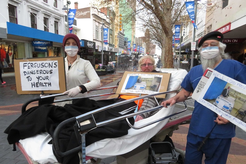 Former patients protest ongoing bed shortages at the Royal Hobart Hospital.