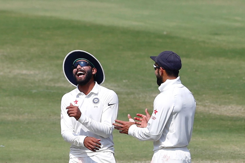 Indian players celebrate a wicket