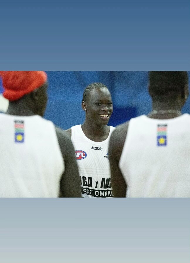 Chadwer smiles in a grainy photo taken during a sport training