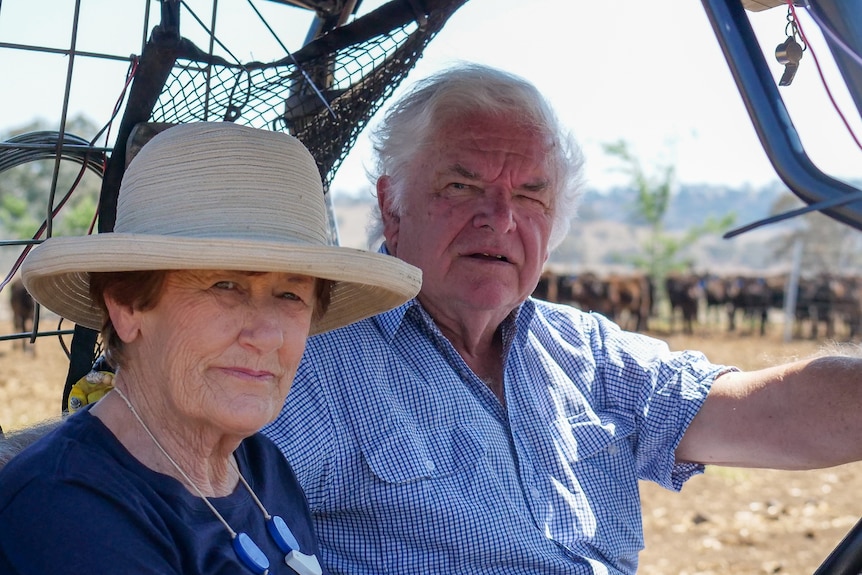 A photo of Paula and David Stevenson on a farm buggy on the farm near Scone in New South Wales, September 2023.
