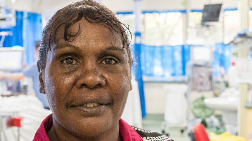 Close up of Indigenous woman standing in a renal dialysis unit