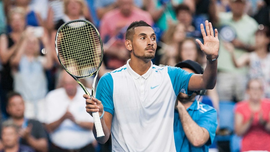Nick Kyrgios celebrates his win for Australian Green over Great Britain at the Hopman Cup.