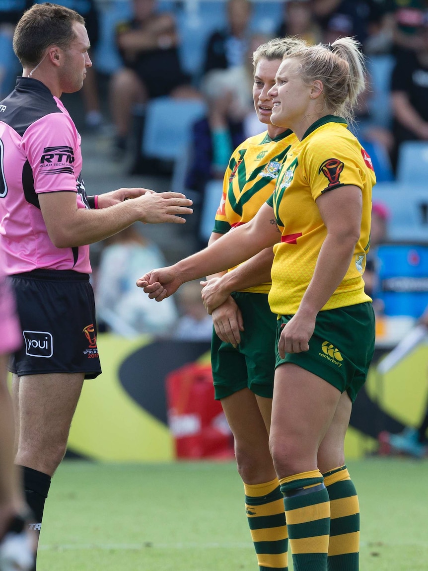 Renae Kunst speaks to the referee after making a biting allegation against Canada.