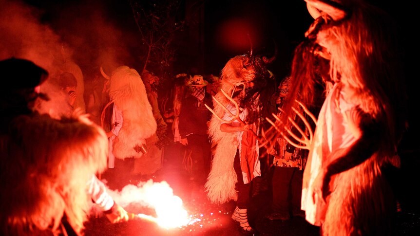 People dress as Momotxorros, half bull, half man figures dressed in blood soaked sheepskins