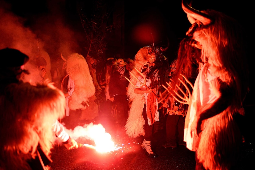 People dress as Momotxorros, half bull, half man figures dressed in blood soaked sheepskins