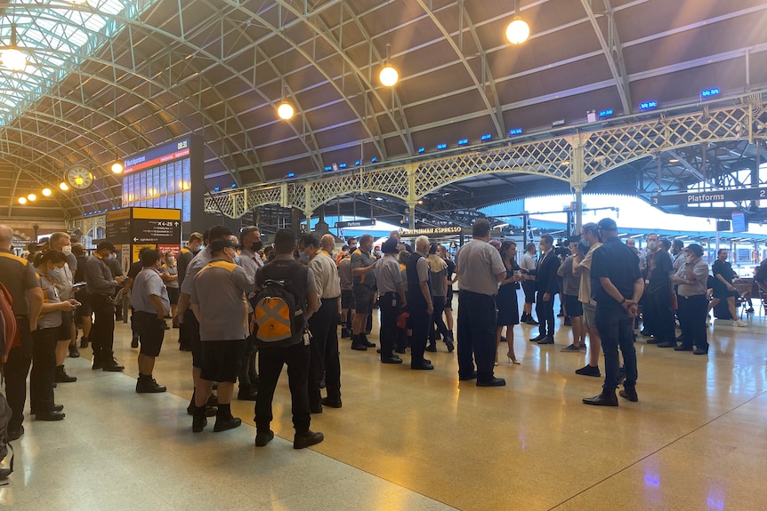 Train drivers stood on a platform