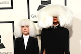 Singer Sia and Dance Moms star Maddie Ziegler arrive at the 57th annual Grammy Awards in Los Angeles, California February 8, 2015.