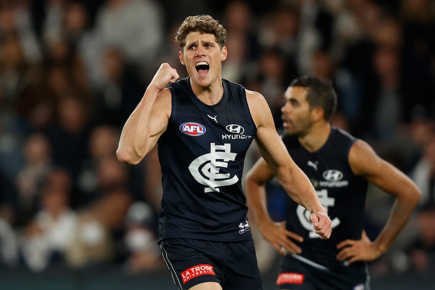 Charlie Curnow of Carlton pumps his fist in celebration of a goal against Adelaide