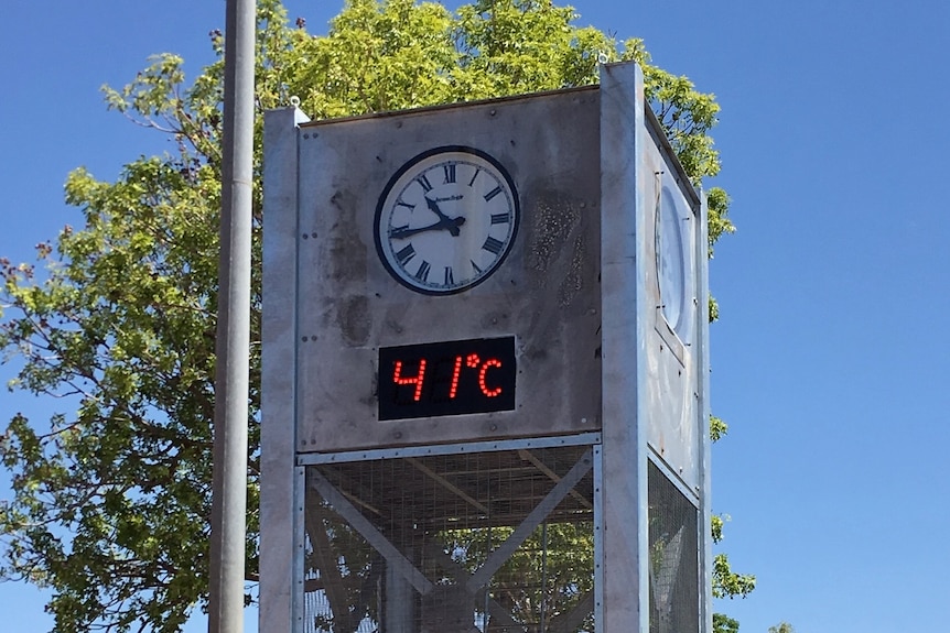 A clock tower shows 41C on the temperature gauge.