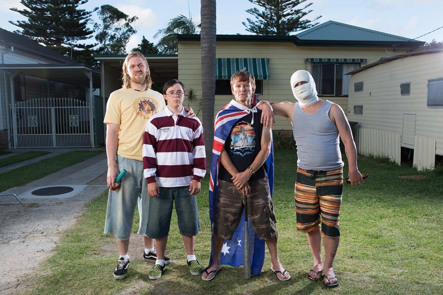 Four men stand in front of a house in Cronulla.