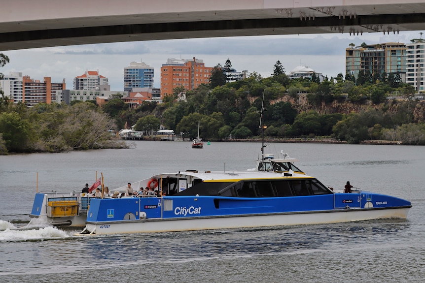 A ferry heading along the river.