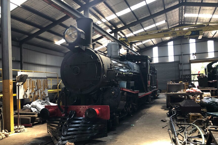 Historic steam engine inside a shed