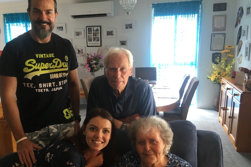 Young woman with her late grandparents, smiling in 2019