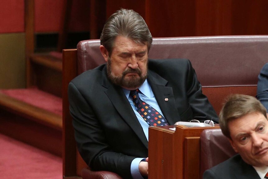 Senator Derryn Hinch is seen sleeping during the opening of the 45th Parliament.