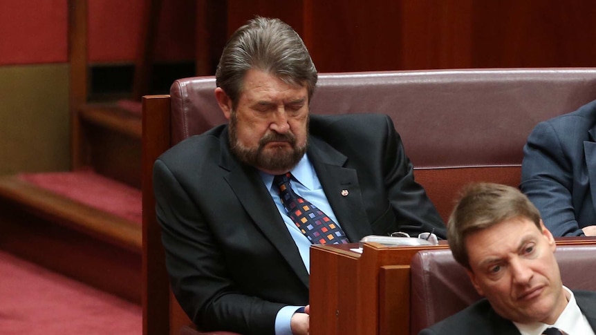Senator Derryn Hinch is seen sleeping during the opening of the 45th Parliament.