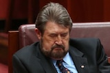 Senator Derryn Hinch is seen sleeping during the opening of the 45th Parliament.