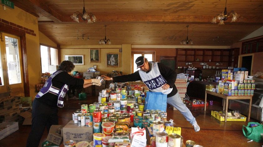 Volunteers arrange food donations in Kinglake.