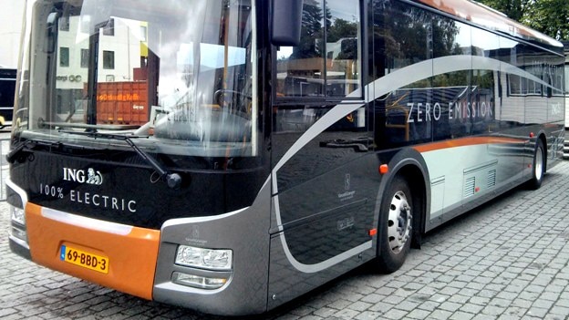 A black, grey and orange electric bus with 'zero emission' written on the side