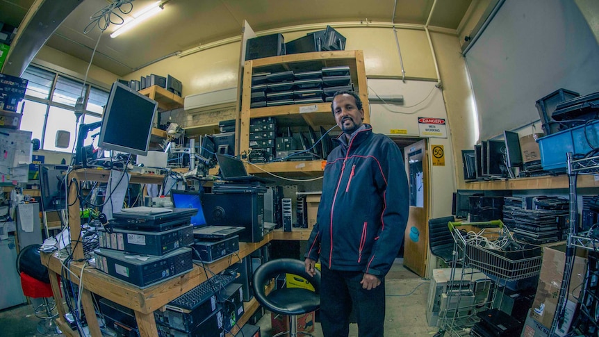 Hamdi Ali in the shed filled with computers