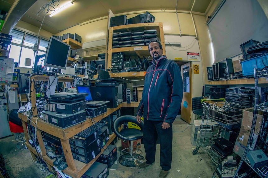 Hamdi Ali in the shed filled with computers