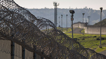 Multiple layers of steel walls, fences, razor wire and other barricades from the US side of the US-Mexico border.