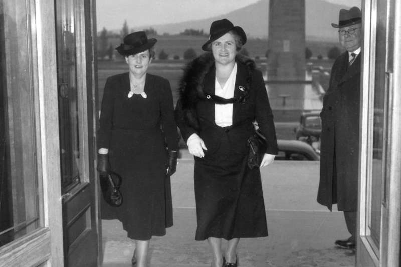 Dorothy Tangney and Enid Lyons walk through the doors of Old Parliament House together.