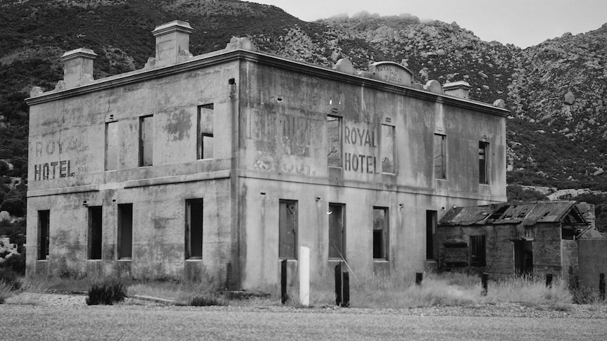 Exterior of an old and abandoned hotel.