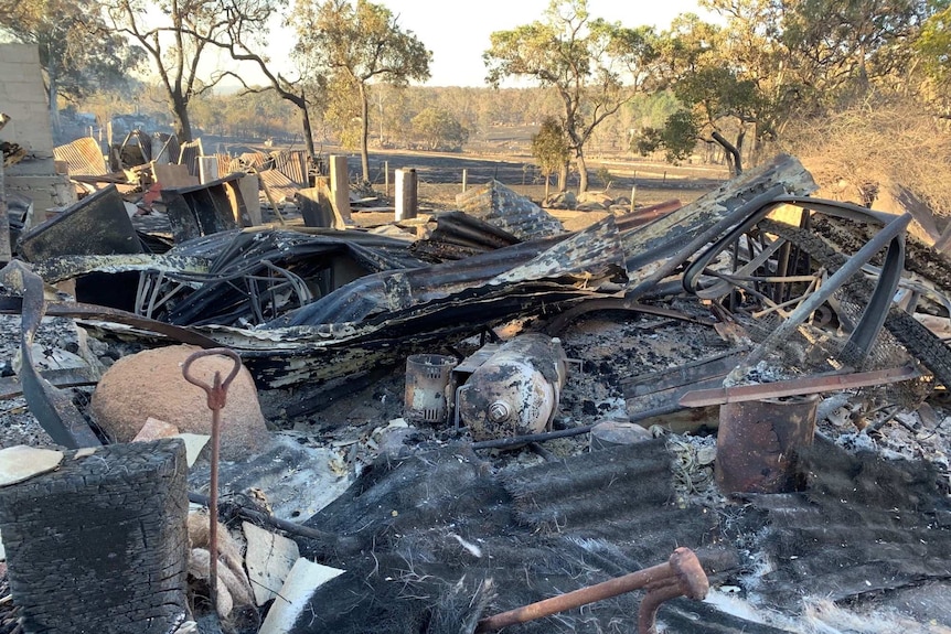 A blackened and burnt out house.