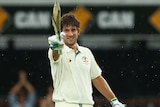 Australia's Joe Burns celebrates his maiden Test century against New Zealand at the Gabba.