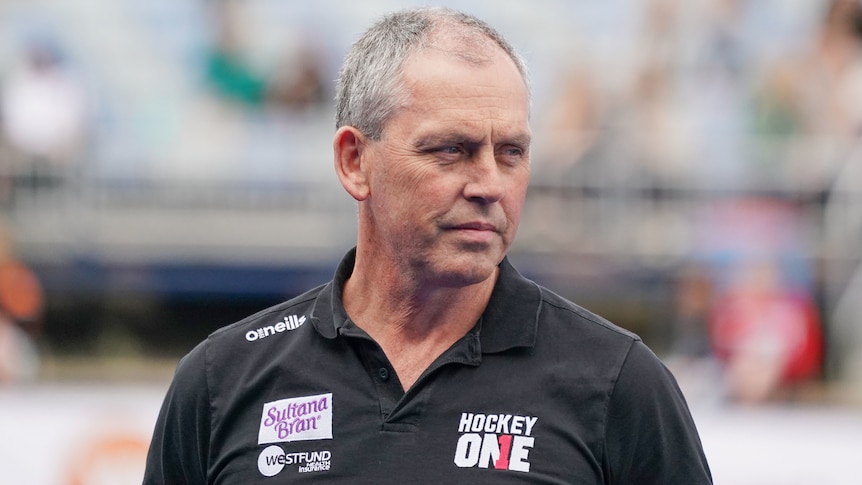 A sporting administrator looks to his left at an event in Melbourne in 2019.