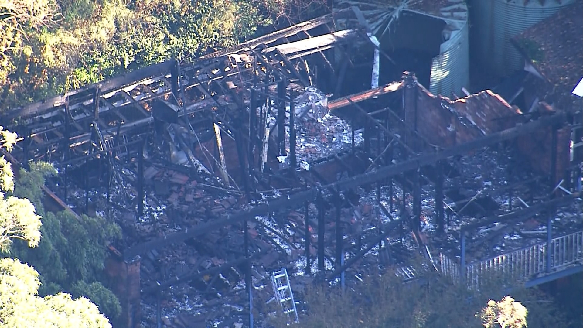 Two dead in house fire on day family were due to move interstate