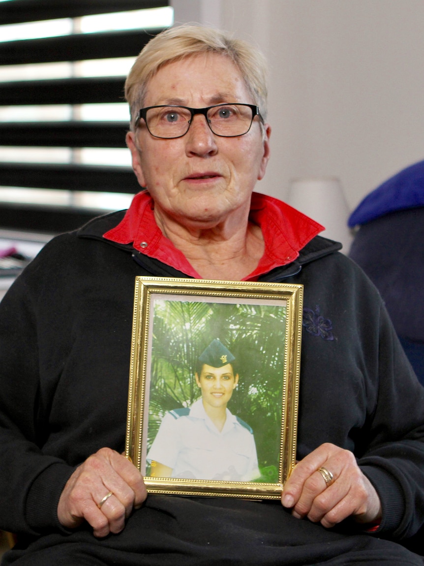 Susan Campbell holds photo of Eleanore Tibble, ADF cadet who took her own life.
