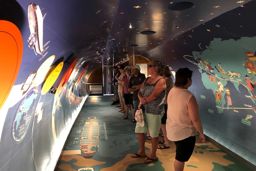 People tour inside the fully refurbished Super Constellation
