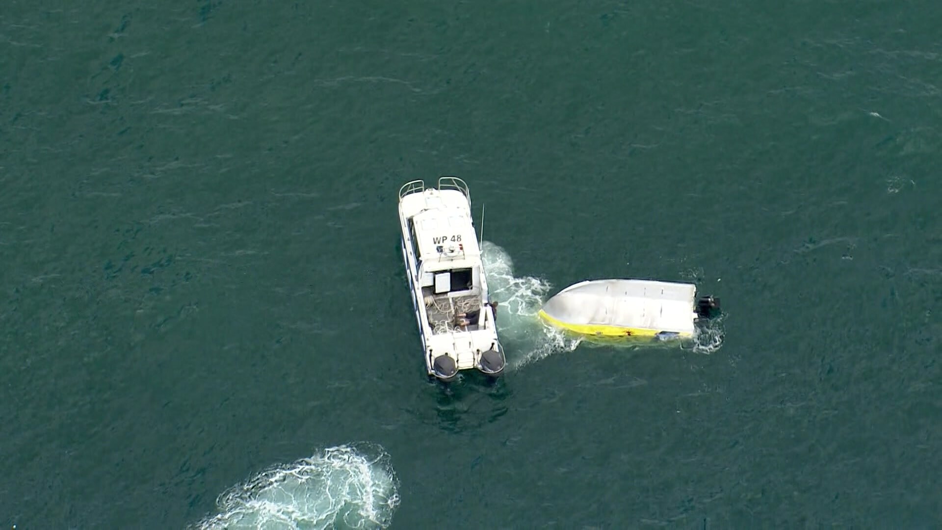 an overturned boat in the ocean