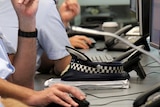 Police work in the G20 Operations Centre at the Queensland Police HQ at Roma Street, Brisbane.