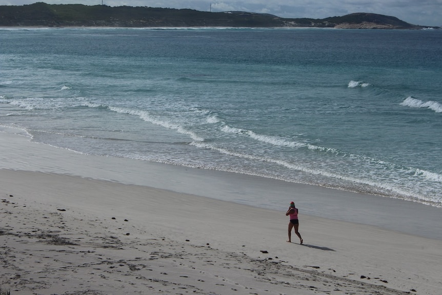 Kath Donovan walks along Twilight Beach