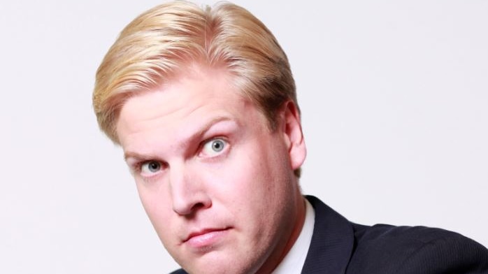 Picture of Mark Humphries in a suit looking at the camera
