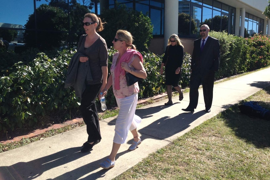 Andrea Shoesmith in pink, Brad Steer behind her.