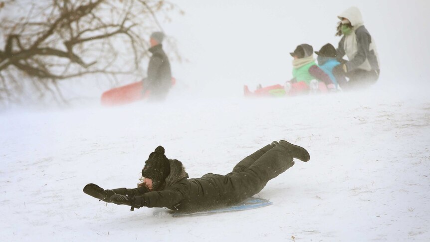 Children play in Chicago snow