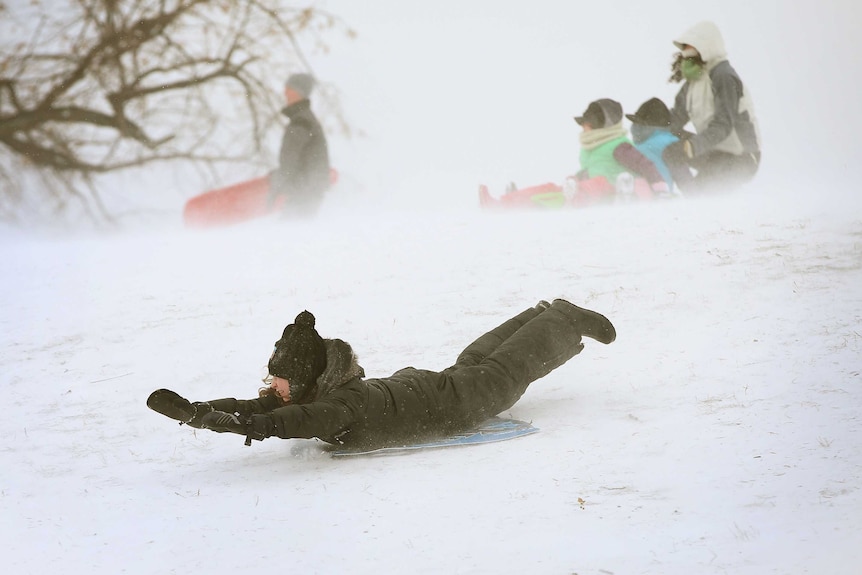 Children play in Chicago snow