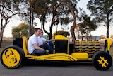 LtoR Steve Sammartino and Raul Oaida drive a car built out of 500,000 pieces of Lego.