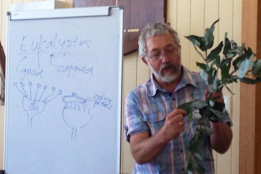 Botanist, Fred Duncan showing landholders how to identify native plants