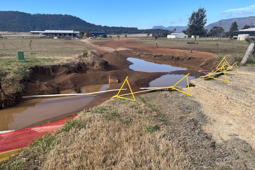 A sinkhole in rural drive way.