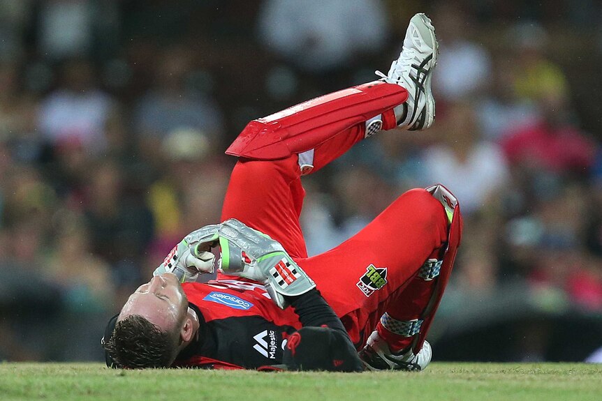 Peter Nevill on the ground against the Sixers