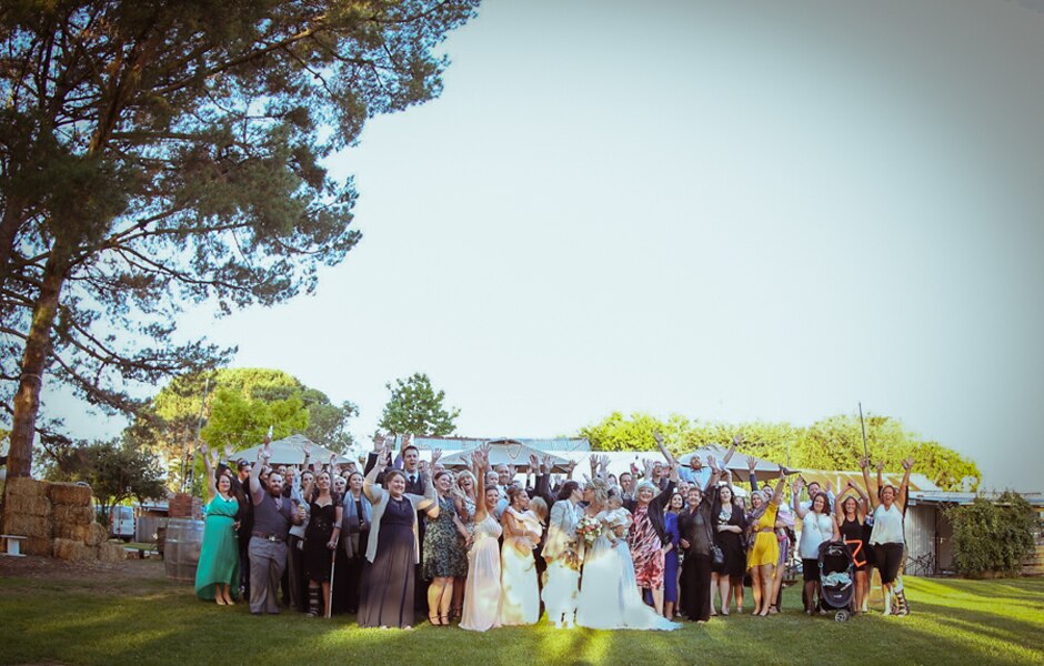 Amanda and Selina with guests at their surprise wedding