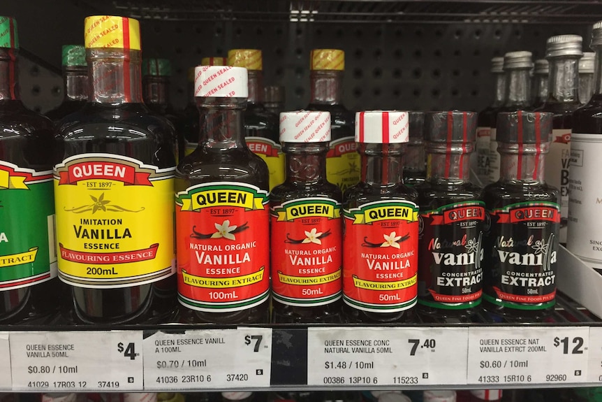 Supermarket shelves stacked with vanilla essence