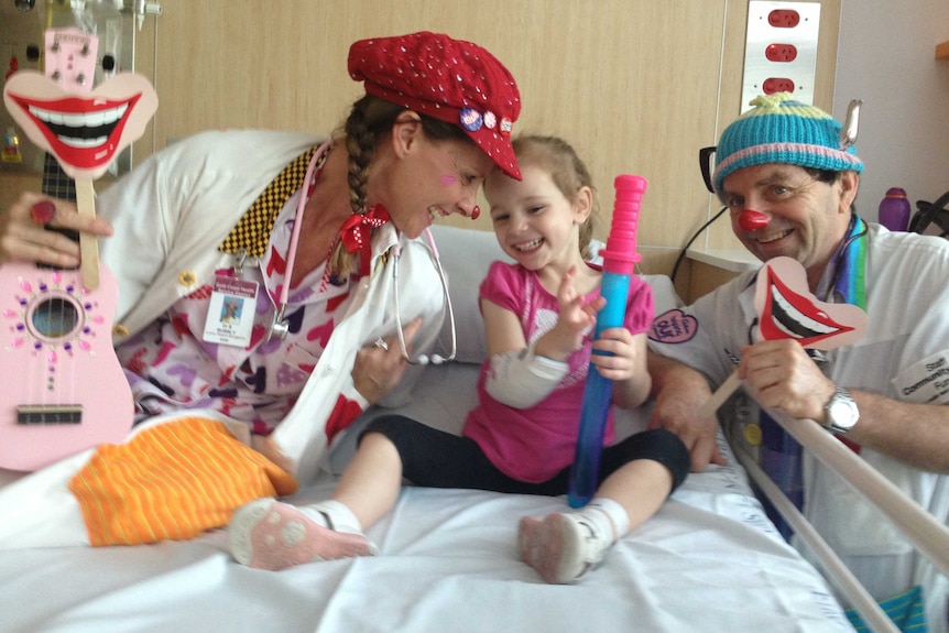 Clown doctors joke with Miley Joseph, 3, after she was transferred to Gold Coast University Hospital.