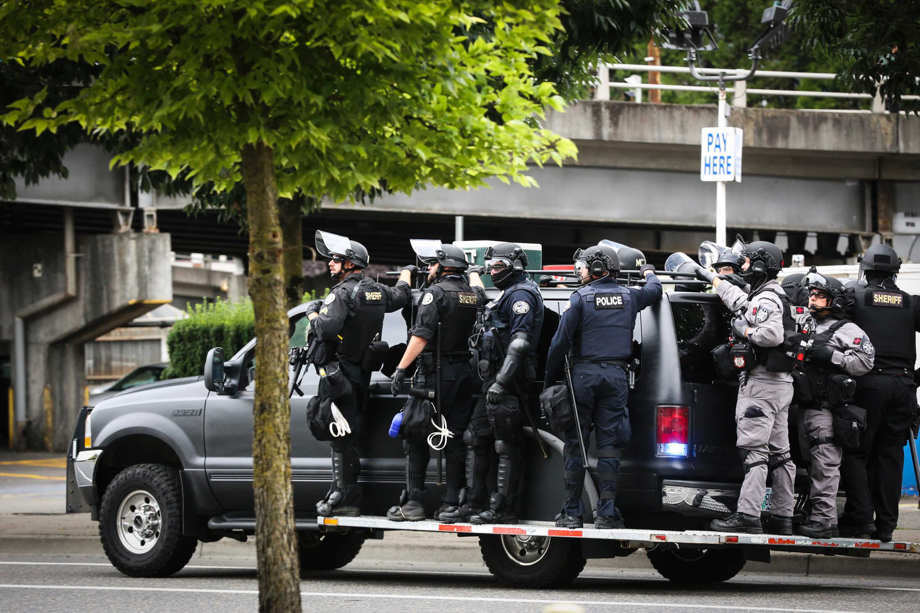 Police flood streets of Portland, Oregon, amid standoff between Proud