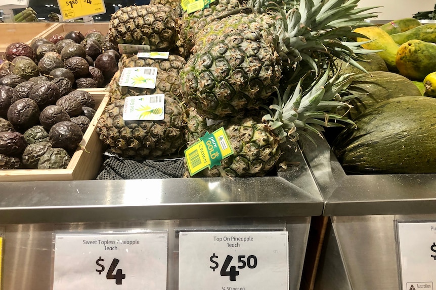 Pineapples on the supermarket shelf.